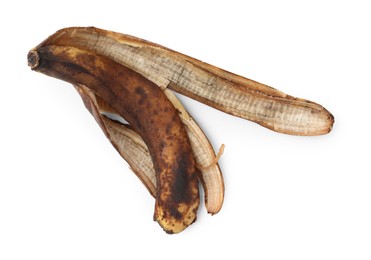 Photo of Banana peel with dark spots isolated on white, top view