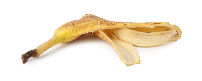 Photo of Banana peel with dark spots isolated on white