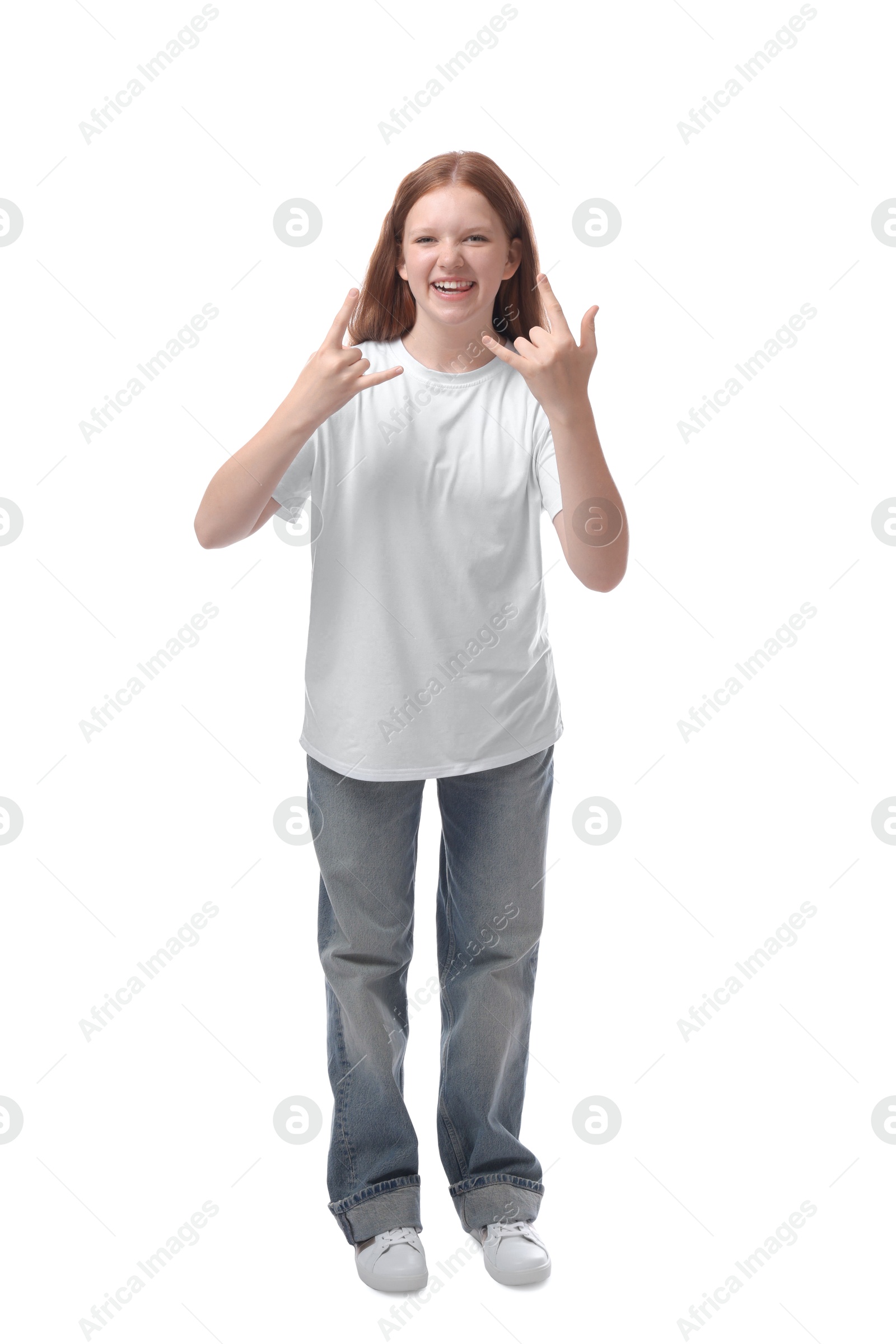 Photo of Teenage girl showing rock gesture on white background