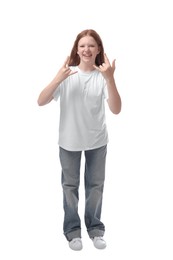 Teenage girl showing rock gesture on white background