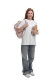 Teenage girl with backpack and books on white background