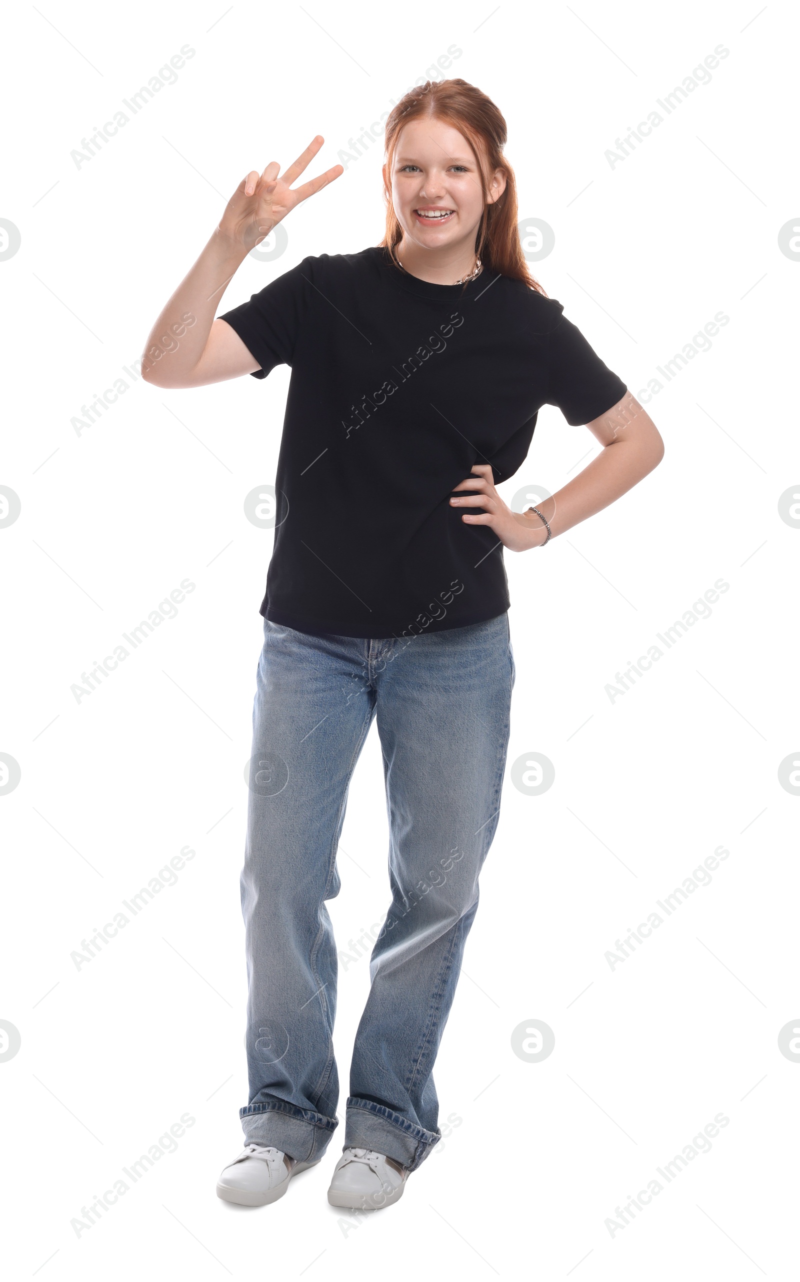 Photo of Teenage girl showing v-sign on white background