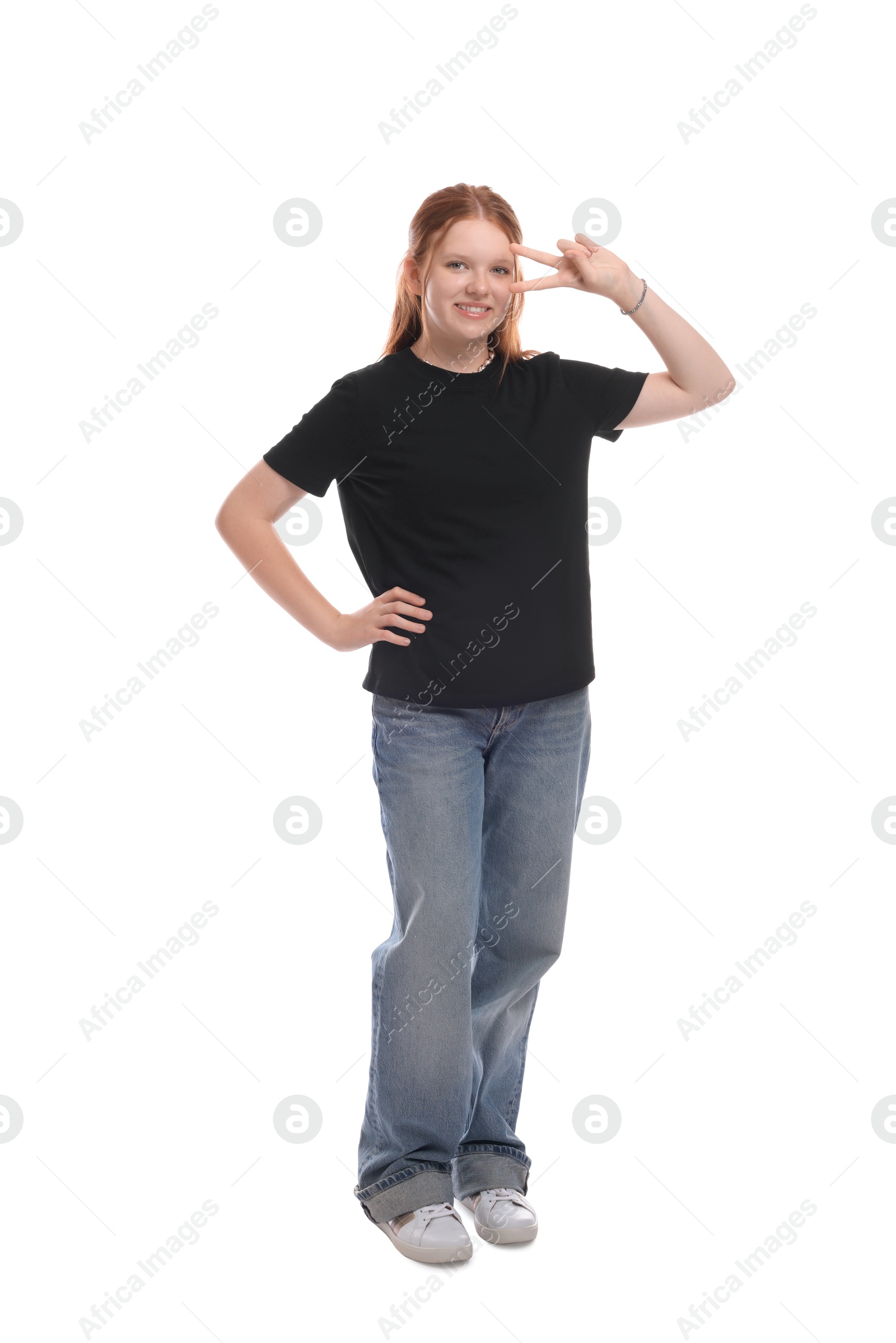 Photo of Teenage girl showing v-sign on white background