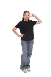 Teenage girl showing v-sign on white background