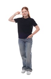 Teenage girl showing v-sign on white background