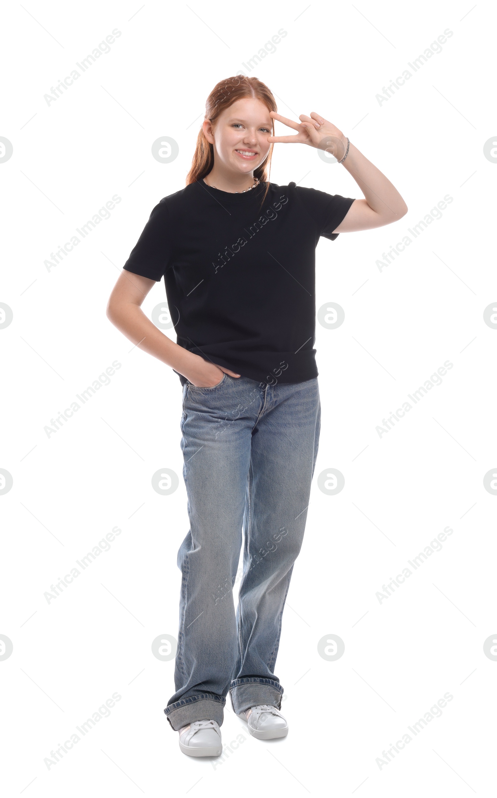 Photo of Teenage girl showing v-sign on white background