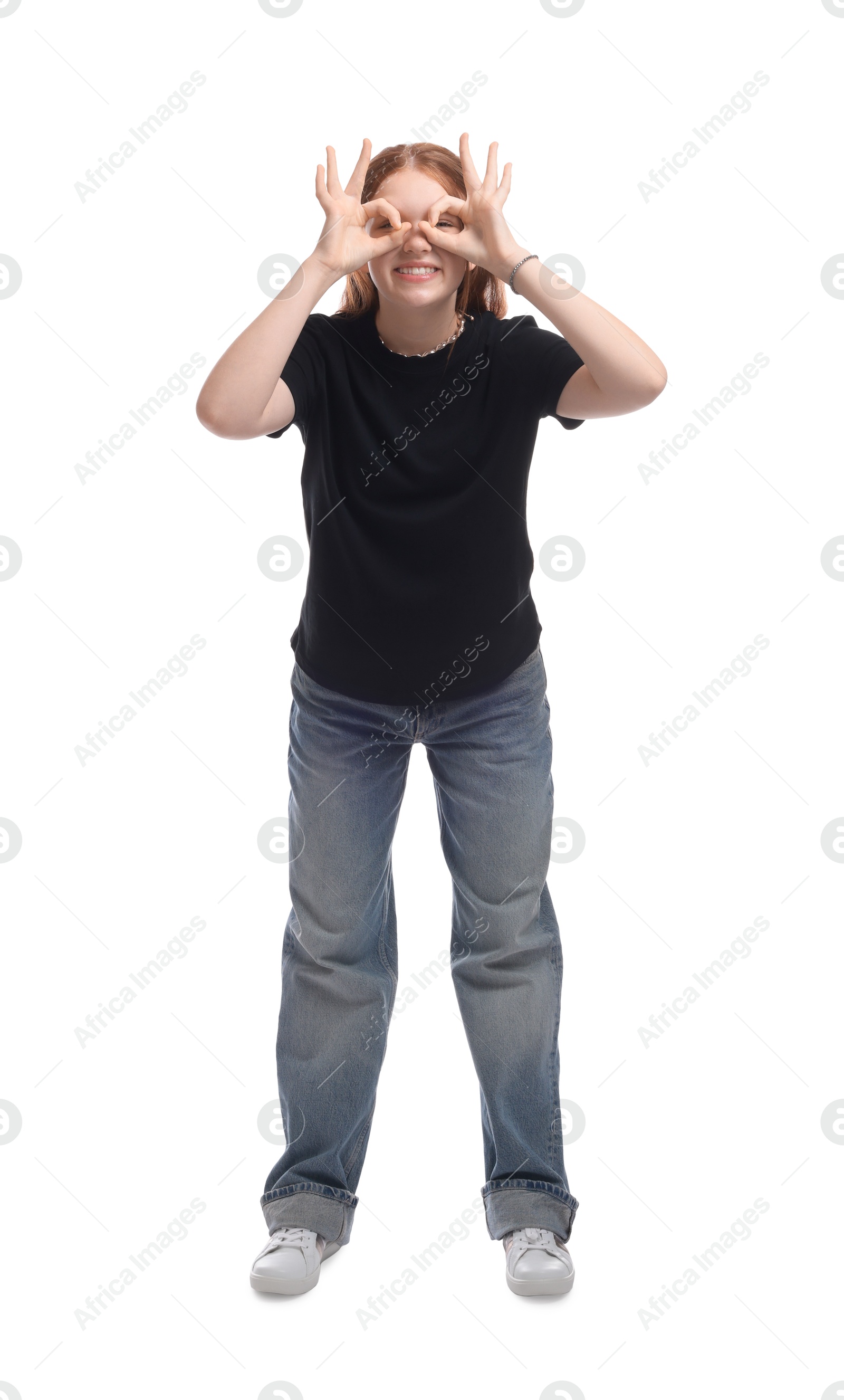 Photo of Cheerful teenage girl posing on white background