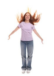 Positive teenage girl jumping on white background