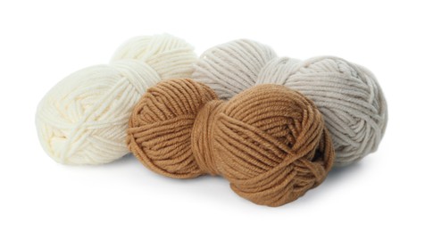 Photo of Skeins of soft yarn for knitting isolated on white