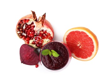 Photo of Tasty beetroot smoothie with mint in glass, fresh vegetable and fruits isolated on white, top view. Vegan drink