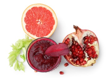 Photo of Tasty beetroot smoothie in glass, fresh vegetables and fruits isolated on white, top view. Vegan drink