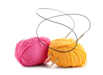 Two bright yarns and knitting needles isolated on white