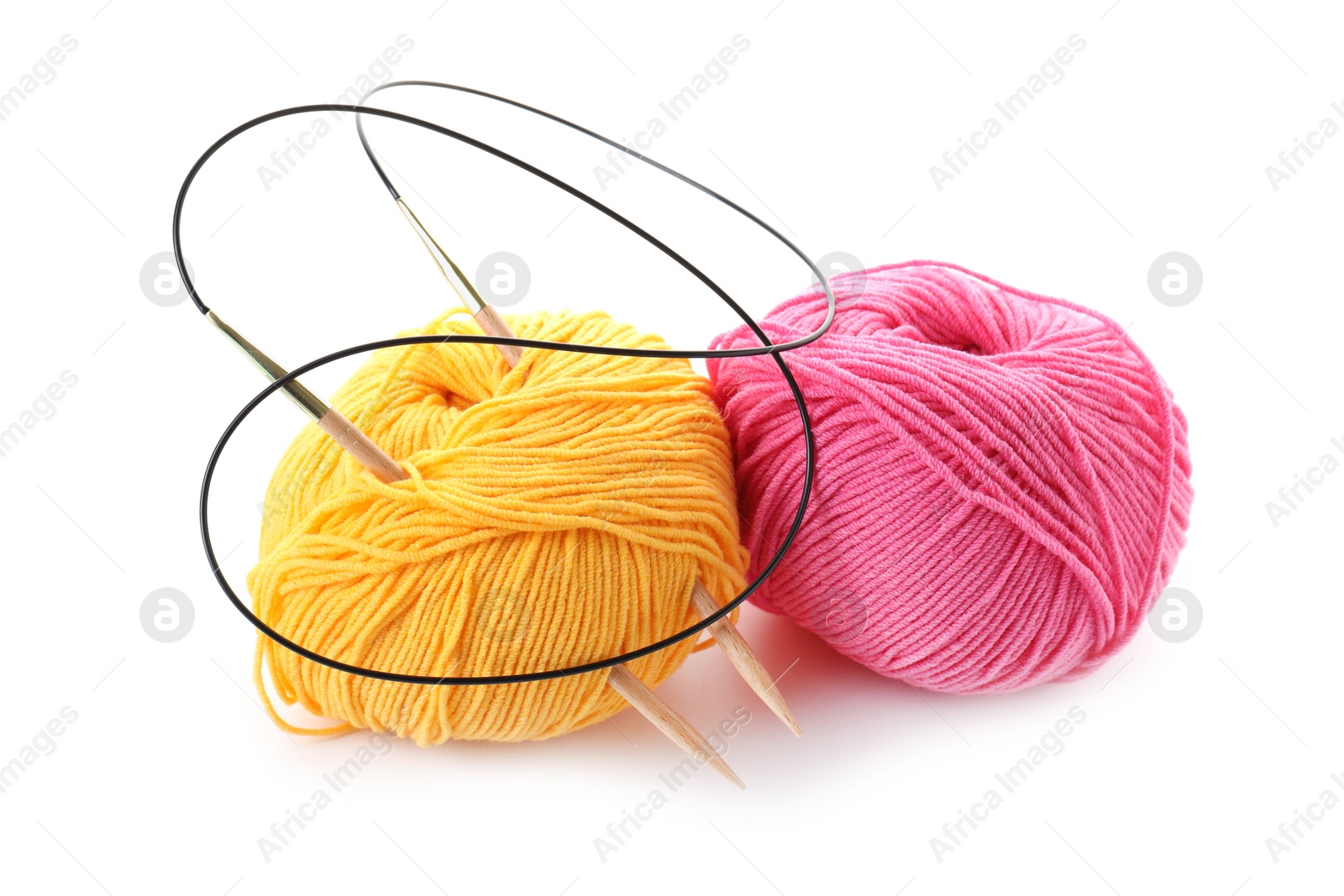 Photo of Two bright yarns and knitting needles isolated on white