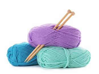 Many bright yarns and knitting needles isolated on white