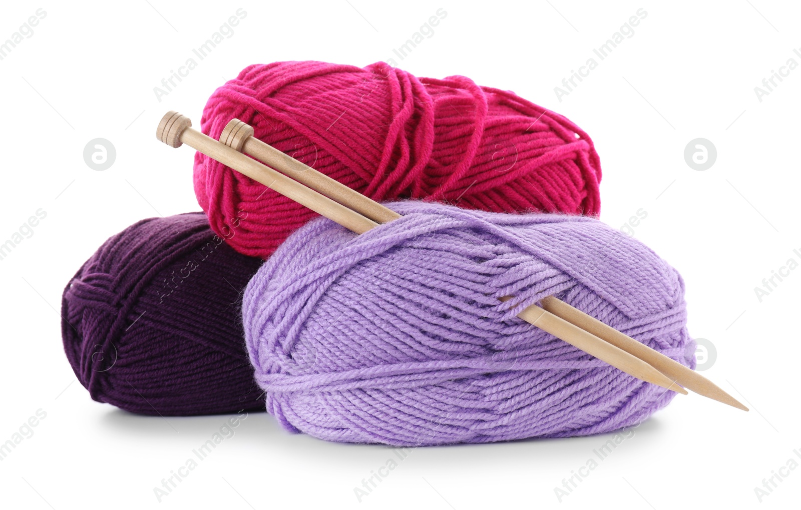 Photo of Many bright yarns and knitting needles isolated on white