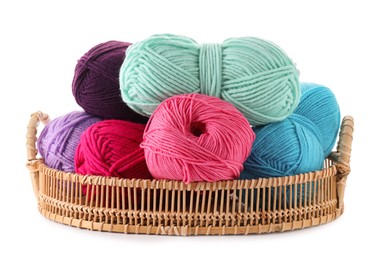 Many bright yarns in wicker basket isolated on white