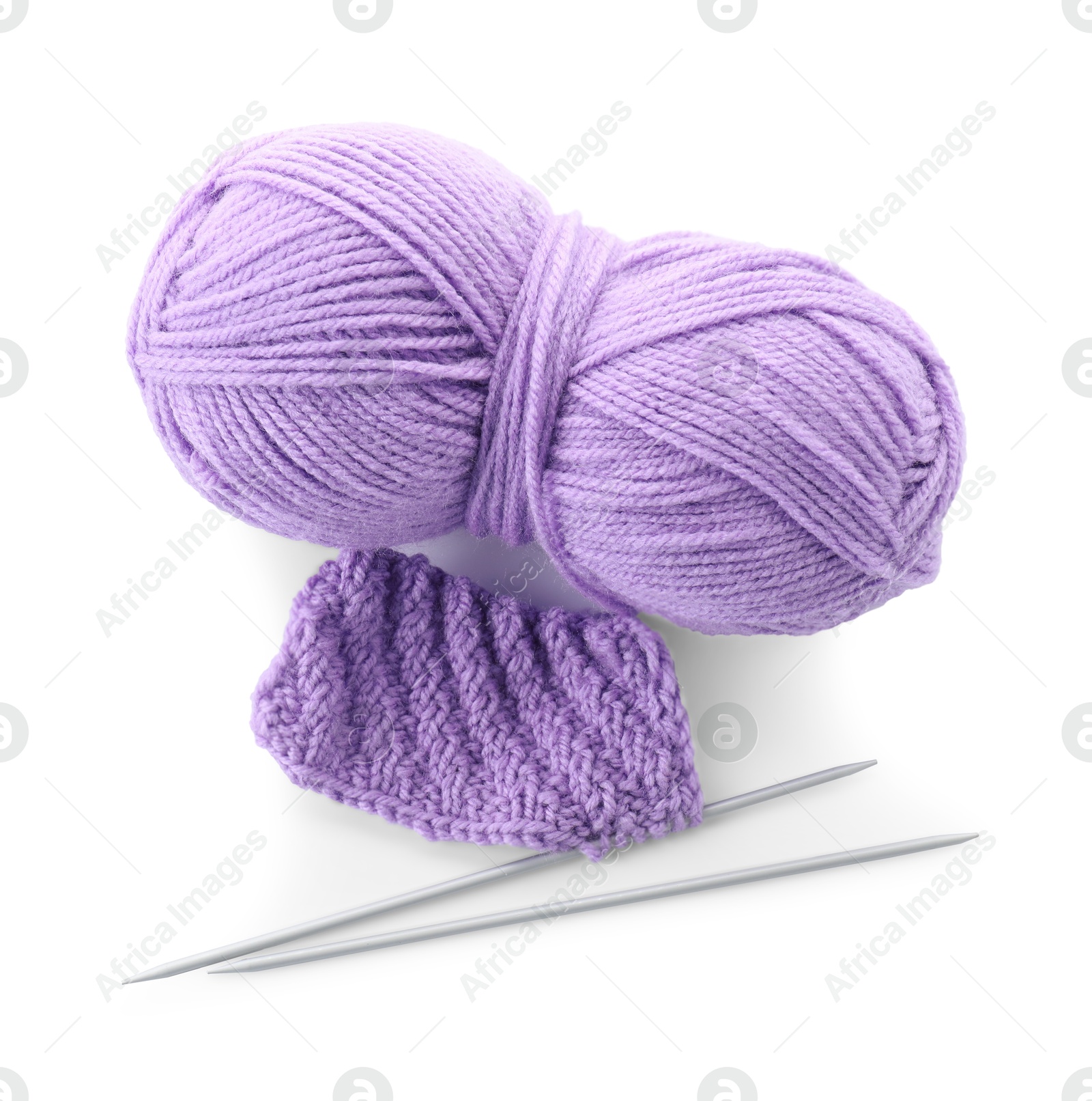 Photo of Skein of violet yarn, knitted fabric and needles isolated on white, top view