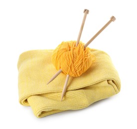 Photo of Ball of yarn with knitting needles and sweater isolated on white