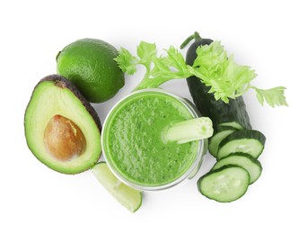 Photo of Tasty green smoothie in glass, cucumber, lime and avocado isolated on white, top view