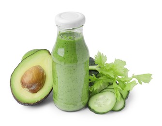 Photo of Tasty green smoothie in bottle, cucumber and avocado isolated on white