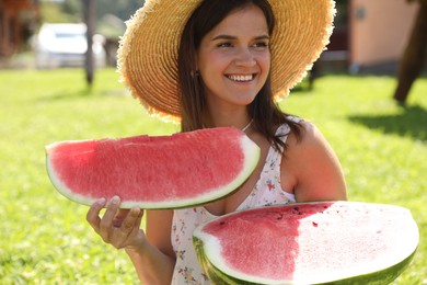 Photo of Happy woman with fresh juicy watermelon outdoors