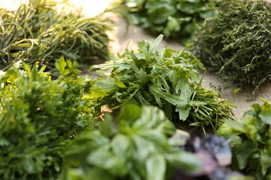 Different fresh herbs on table, closeup view