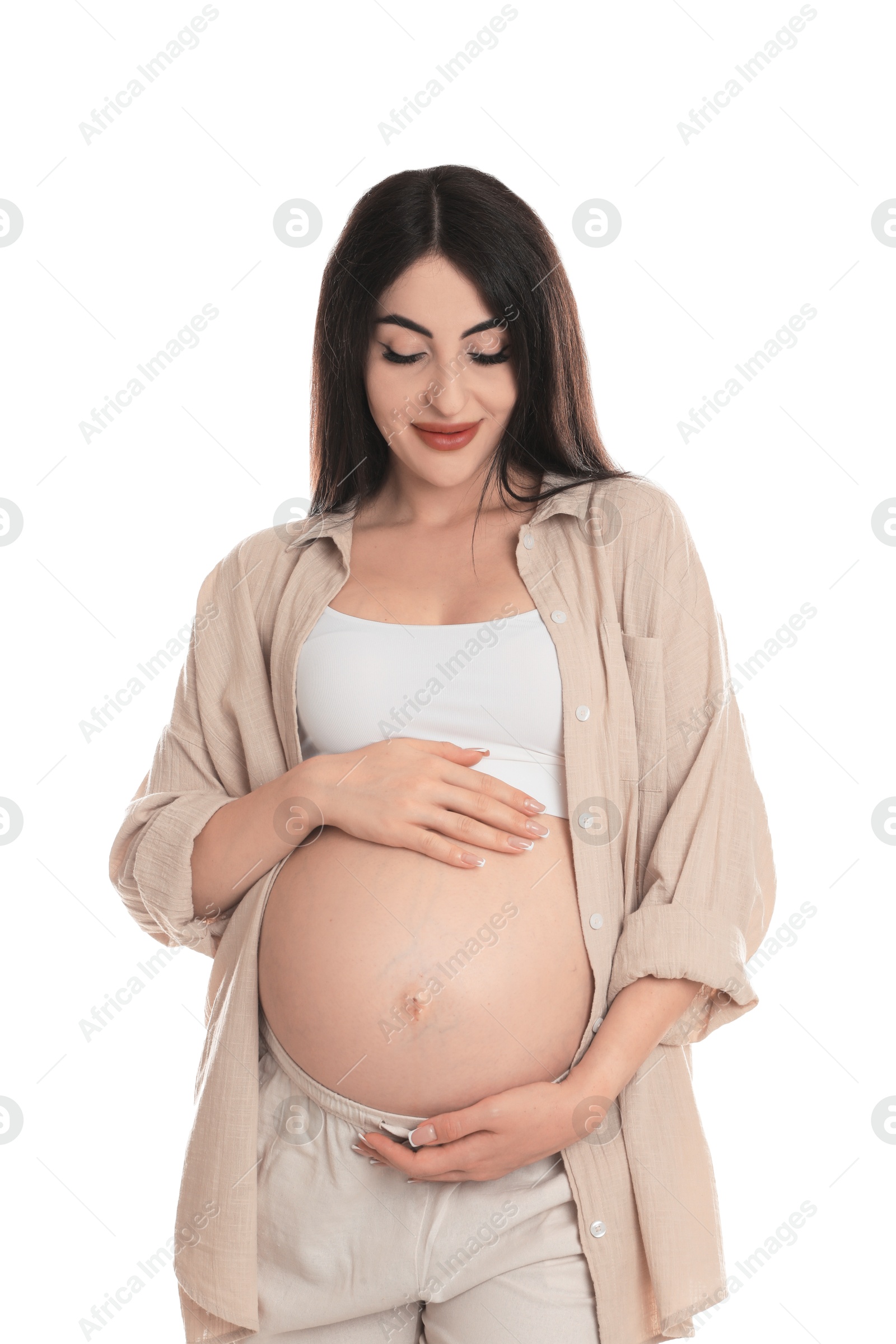 Photo of Portrait of beautiful pregnant woman on white background