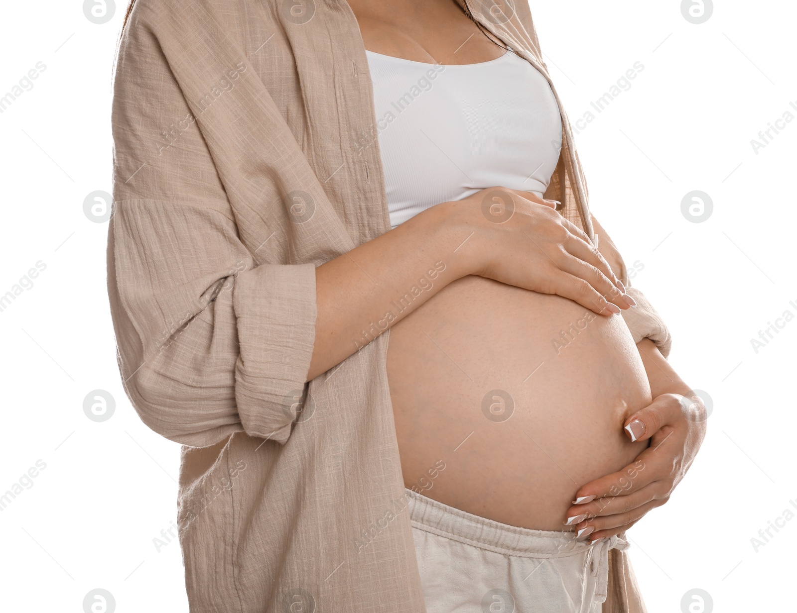 Photo of Young pregnant woman on white background, closeup