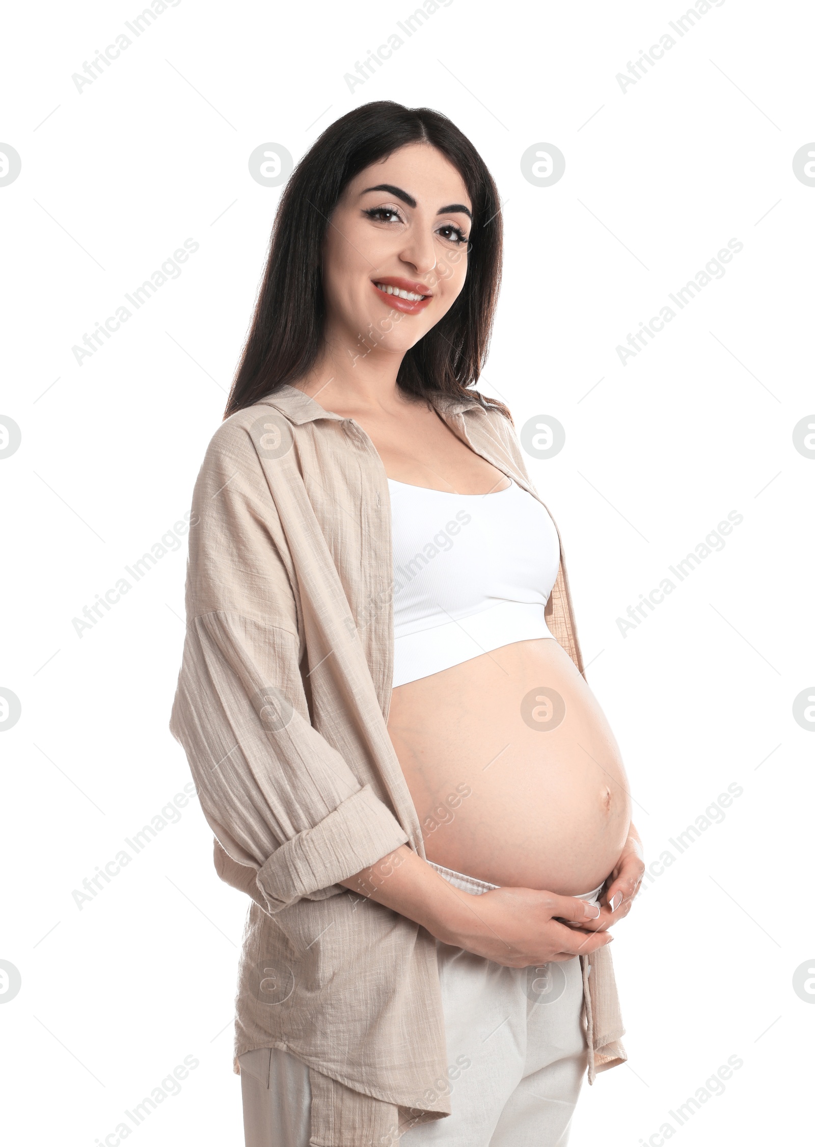 Photo of Portrait of beautiful pregnant woman on white background