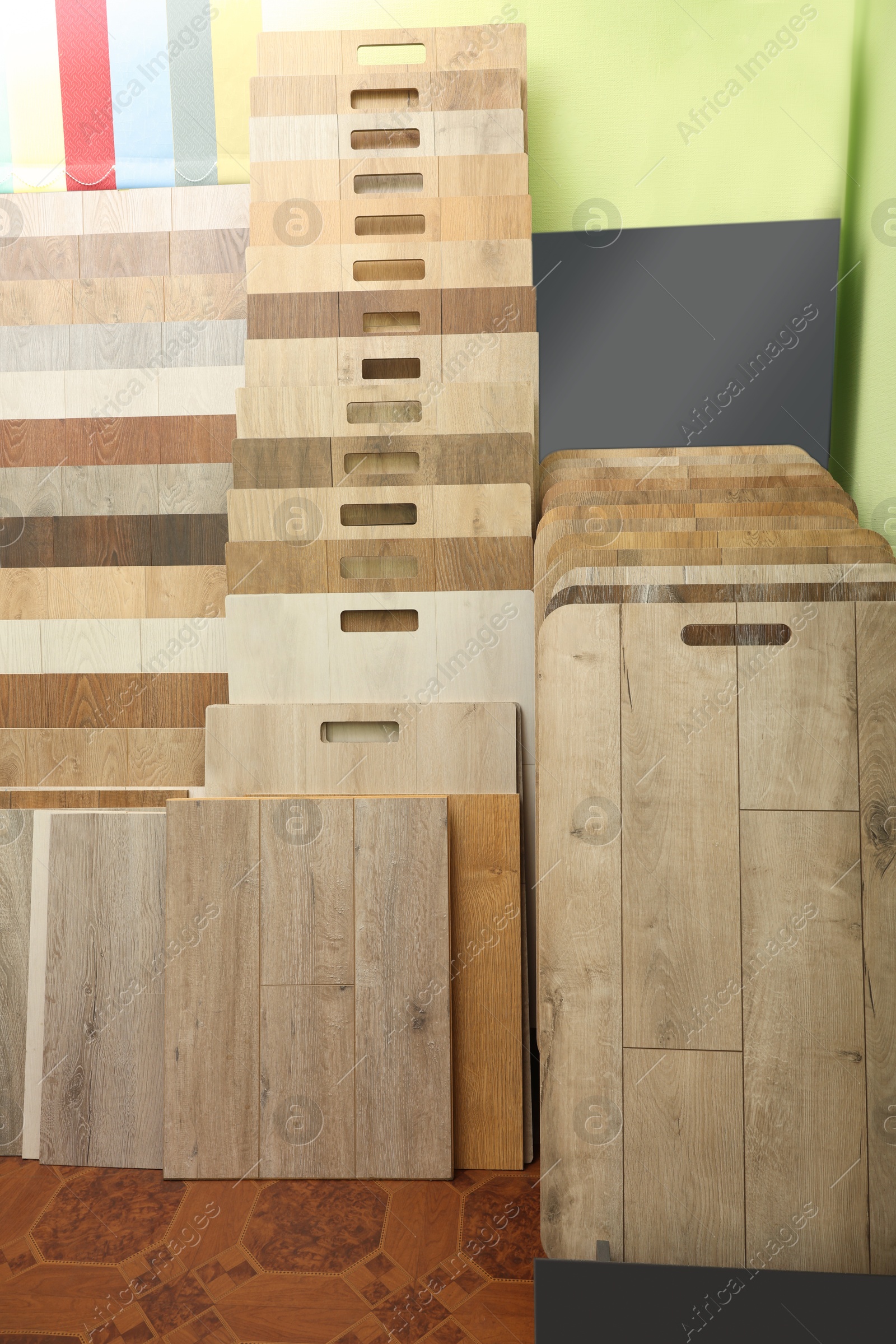 Photo of Many different samples of wooden flooring in store