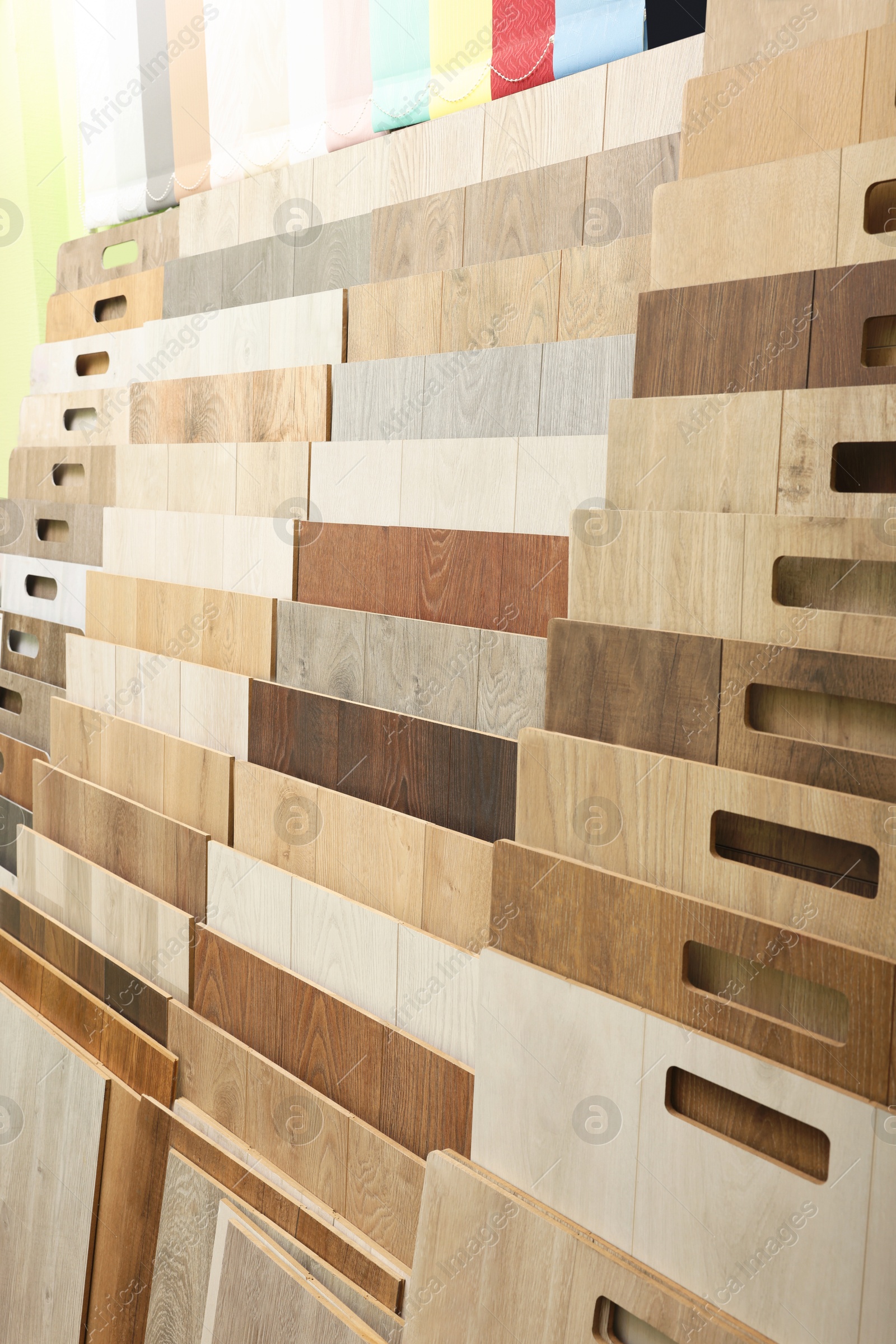 Photo of Many different samples of wooden flooring in store