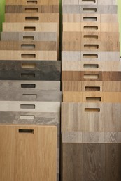 Photo of Many different samples of wooden flooring in store