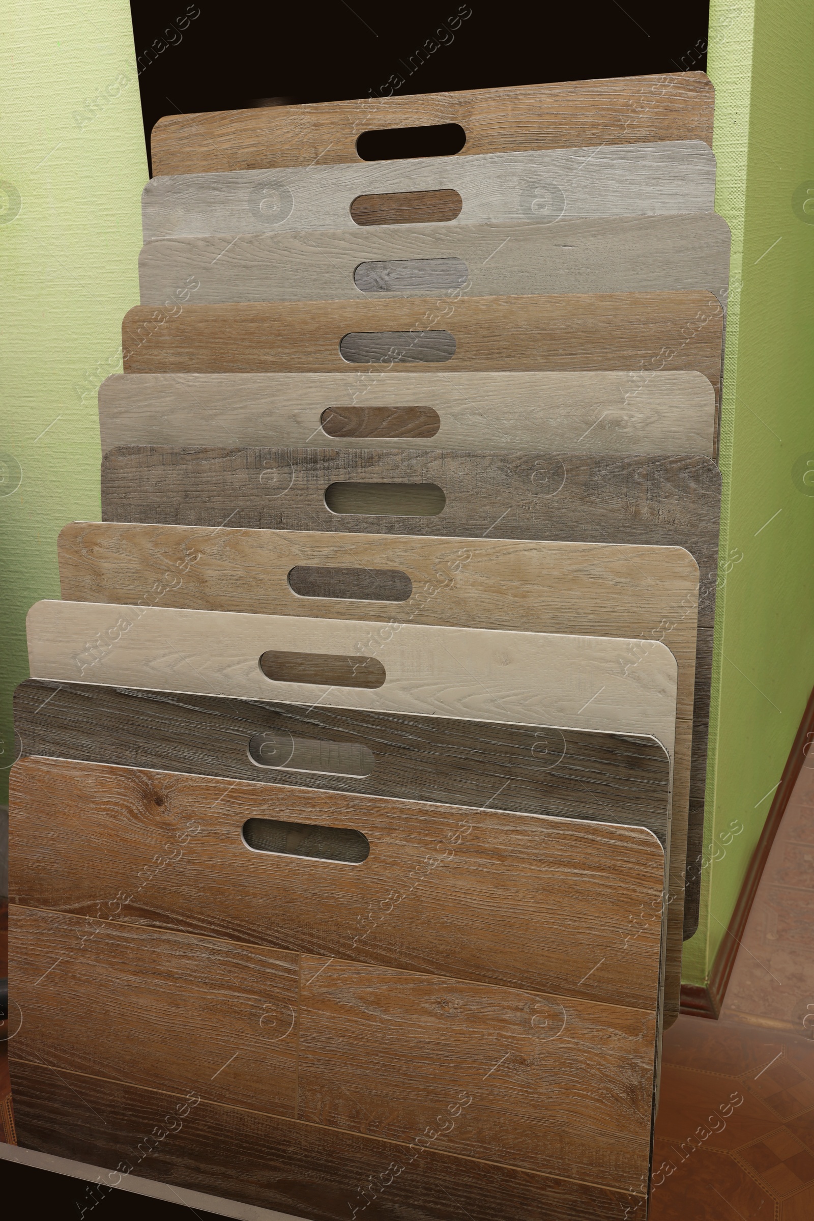 Photo of Many different samples of wooden flooring in store