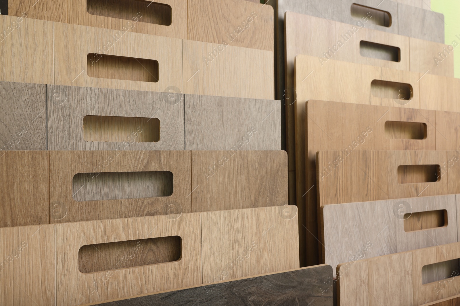 Photo of Many different samples of wooden flooring, closeup