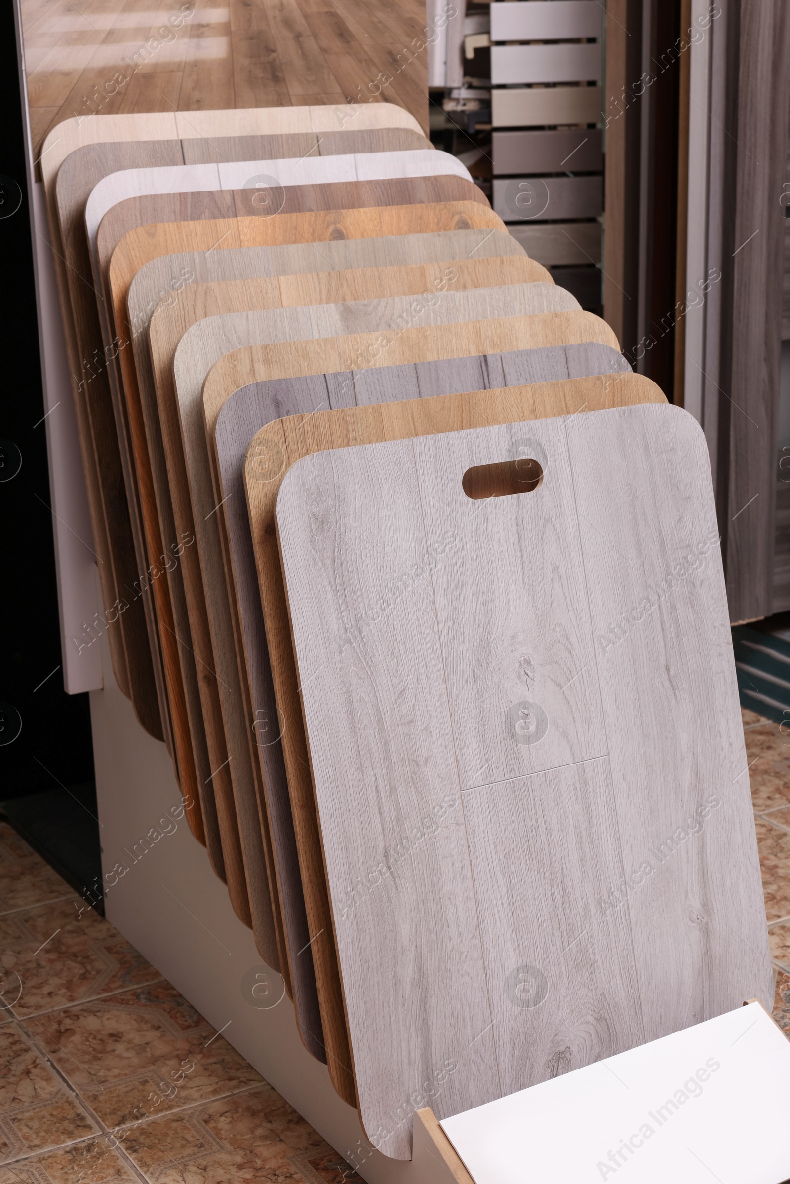 Photo of Many different samples of wooden flooring in store