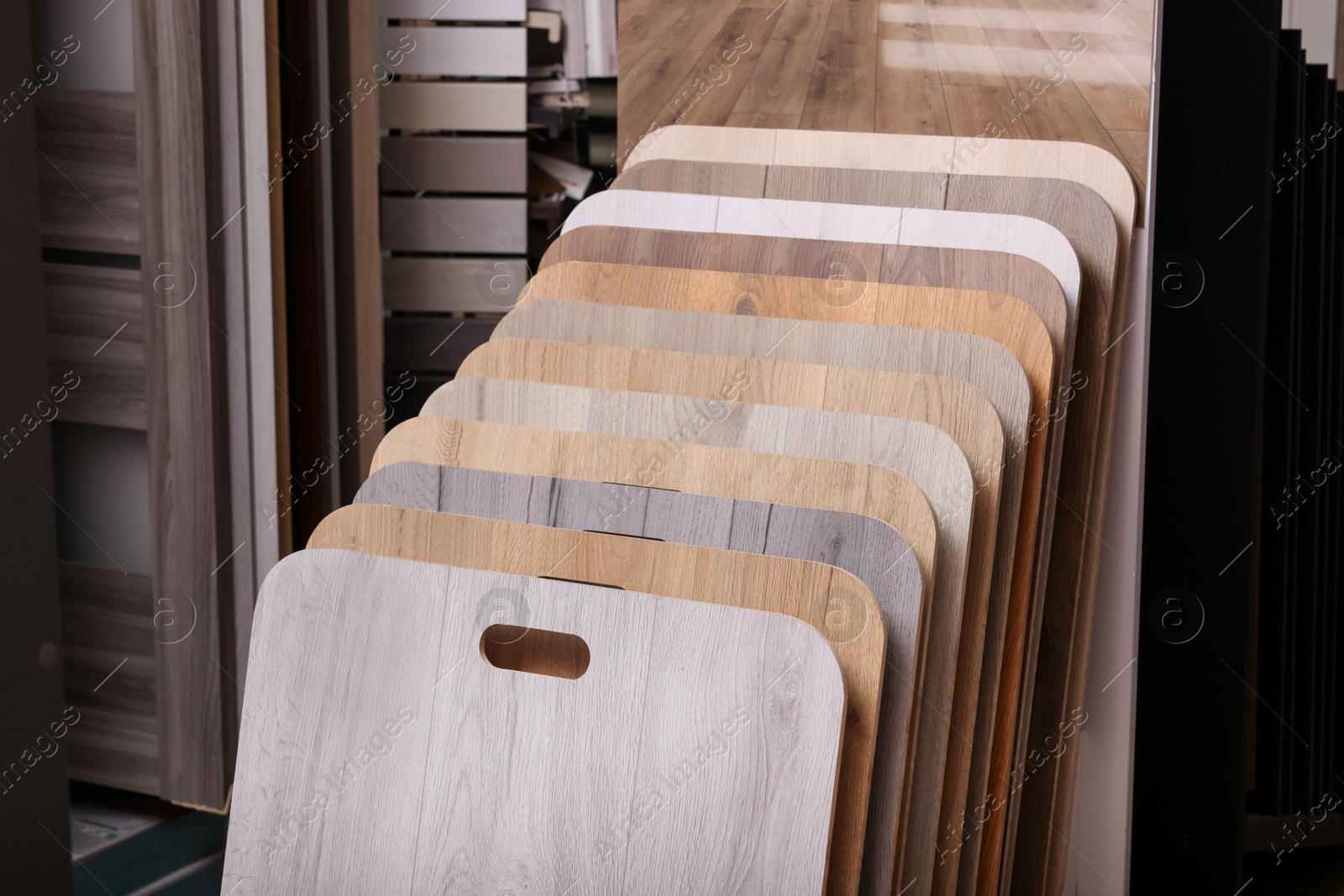 Photo of Many different samples of wooden flooring in store