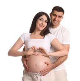 Photo of Beautiful pregnant woman making heart with hands and her husband on white background