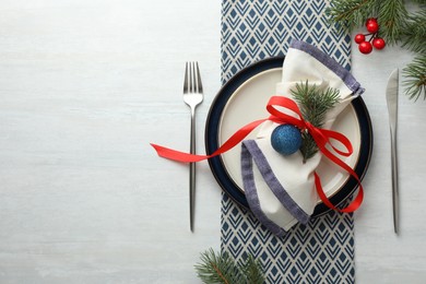 Photo of Christmas table setting with festive decor, flat lay. Space for text