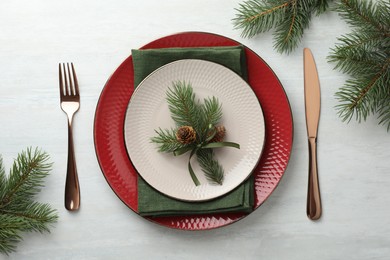 Photo of Christmas table setting with festive decor, flat lay