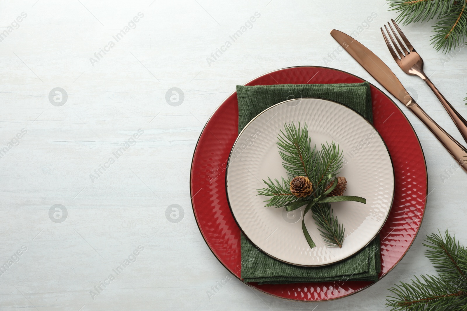 Photo of Christmas table setting with festive decor, flat lay. Space for text