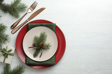 Photo of Christmas table setting with festive decor, flat lay. Space for text