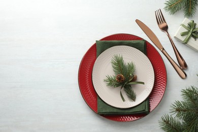 Photo of Christmas table setting with festive decor, flat lay. Space for text