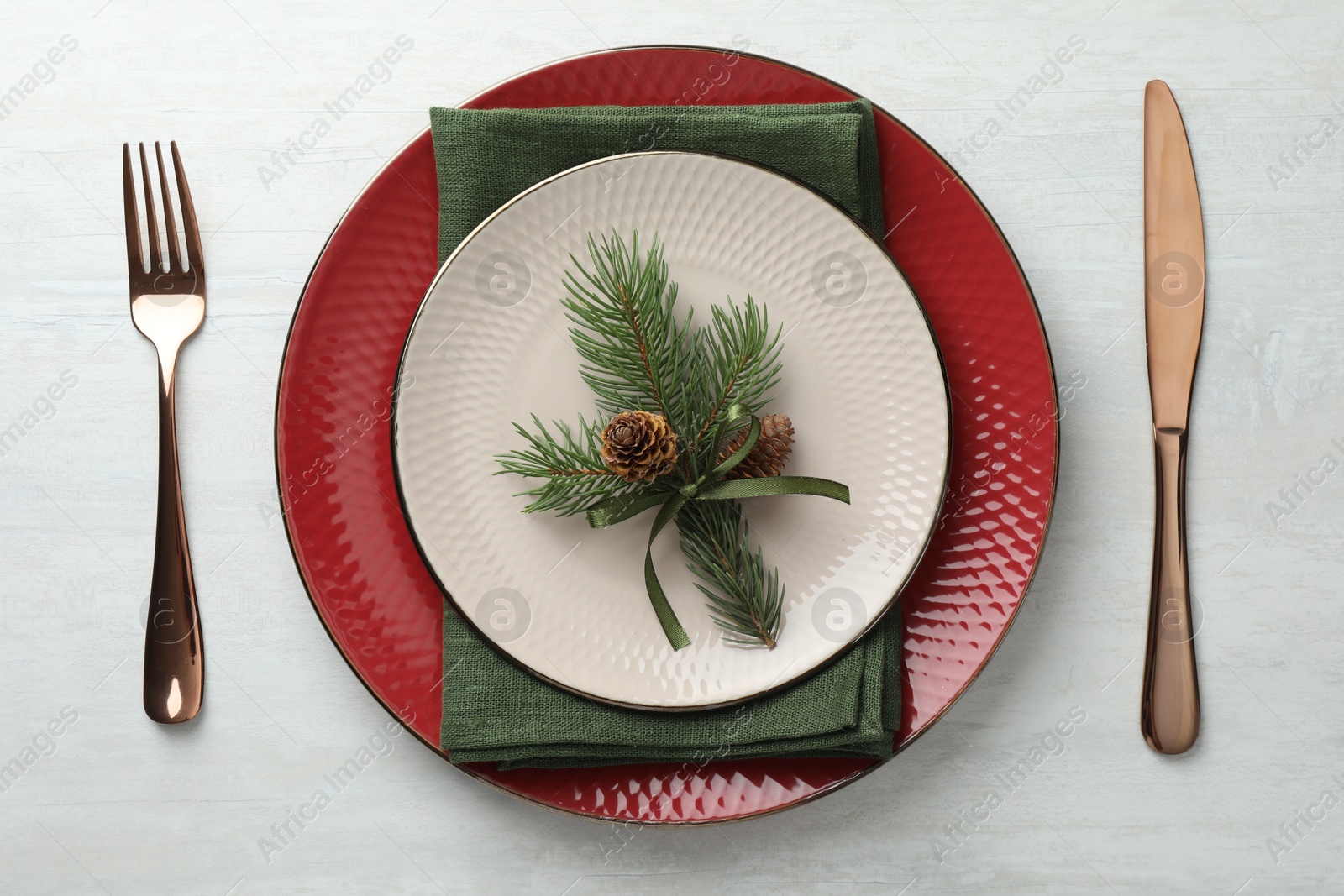 Photo of Christmas table setting with festive decor, flat lay