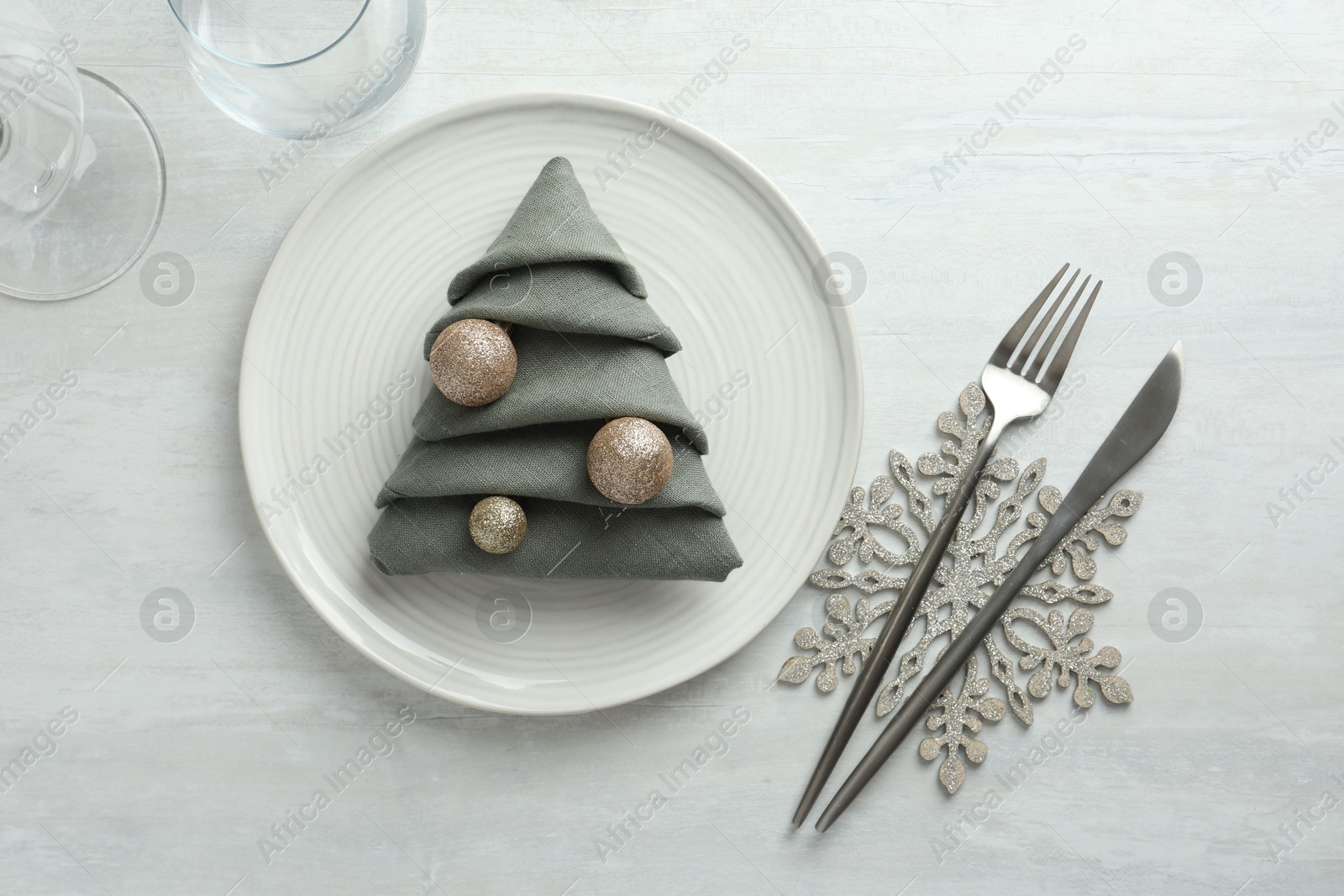 Photo of Christmas table setting with festive decor, flat lay