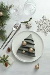 Photo of Christmas table setting with festive decor, flat lay