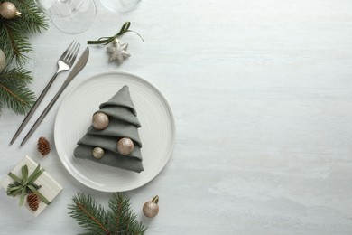 Photo of Christmas table setting with festive decor, flat lay. Space for text