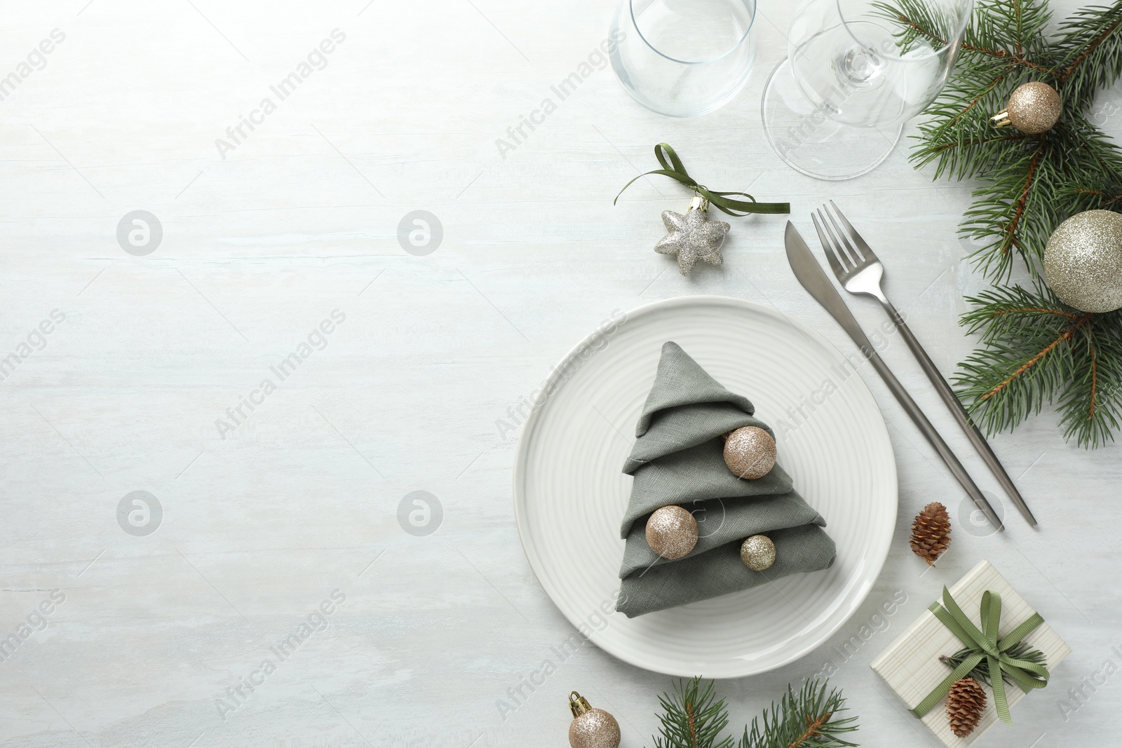 Photo of Christmas table setting with festive decor, flat lay. Space for text