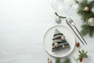 Photo of Christmas table setting with festive decor, flat lay. Space for text