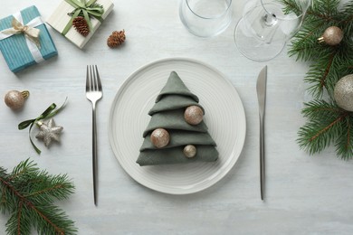 Photo of Christmas table setting with festive decor, flat lay