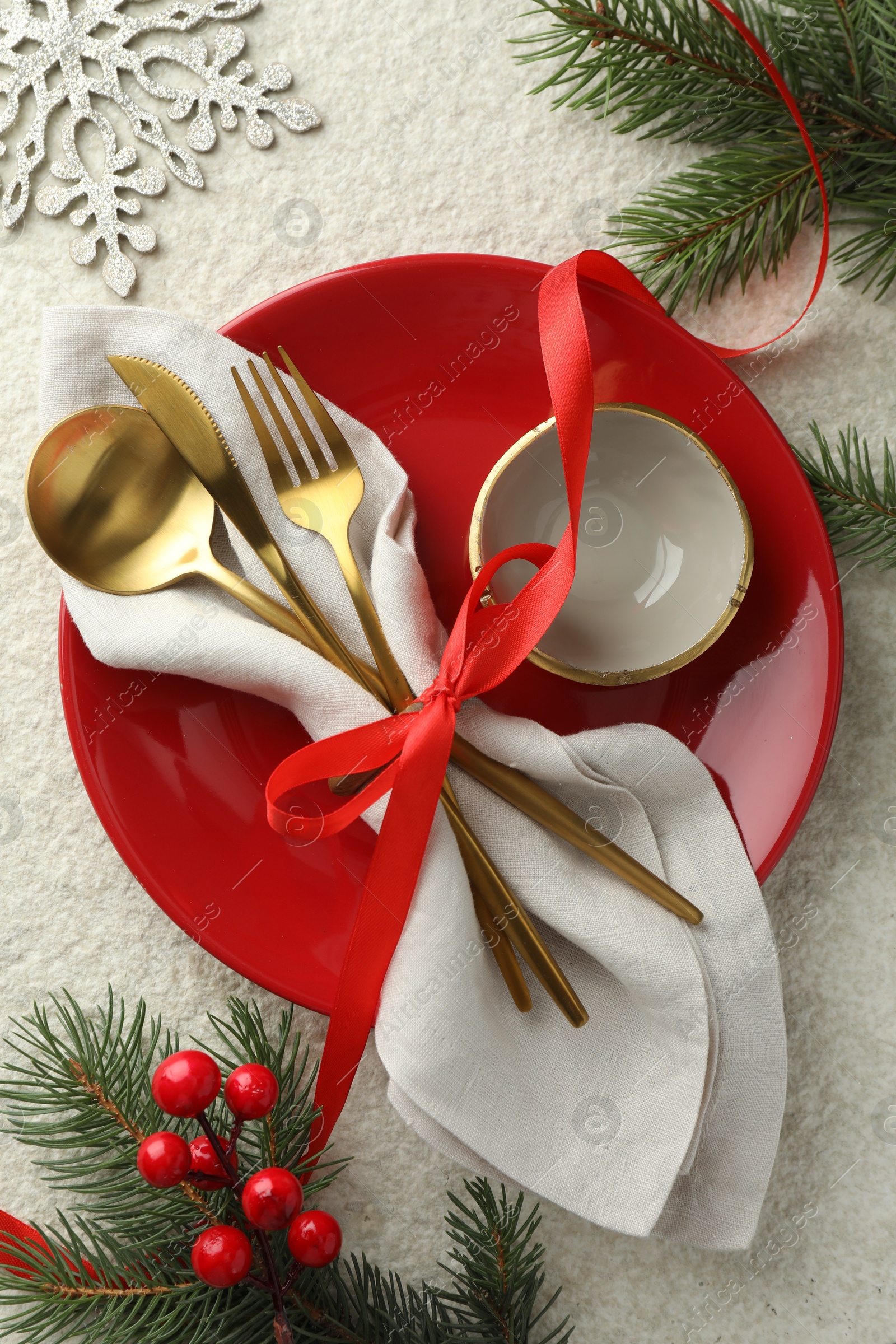 Photo of Christmas table setting with festive decor, flat lay